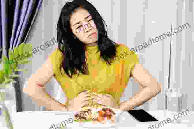 A Photo Of A Person Holding Their Stomach In Pain After Eating The New Allergy Diet: The Step By Step Guide To Overcoming Food Intolerance