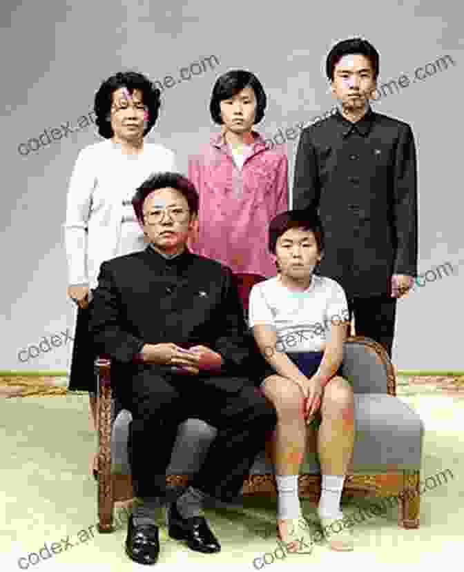 North Korea Flag And Kim Dynasty Family Portrait Under The Loving Care Of The Fatherly Leader: North Korea And The Kim Dynasty